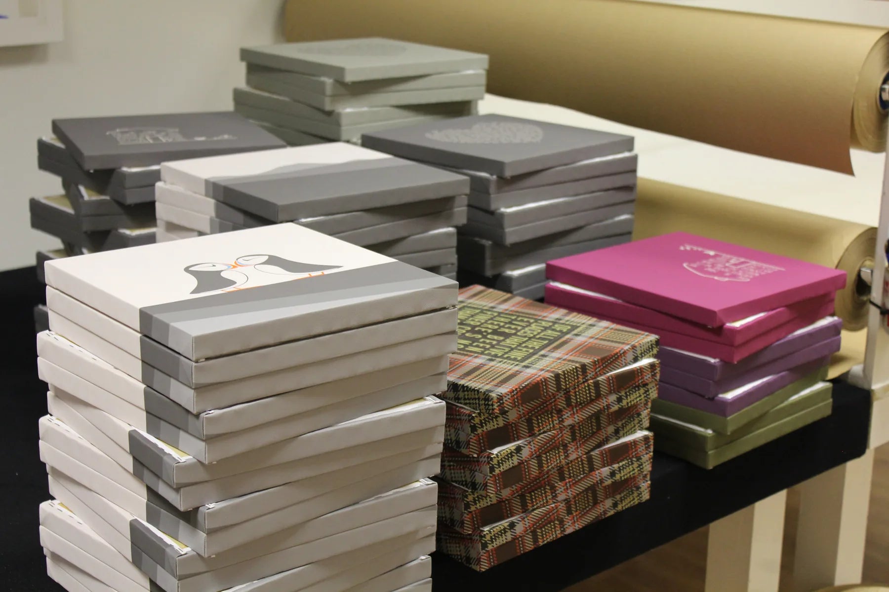 Tall stacks of finished canvas orders ready to leave the workshop