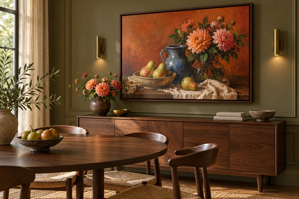 A large richly coloured still-life canvas in a dark wood floating frame above a sideboard in a warm dining room.