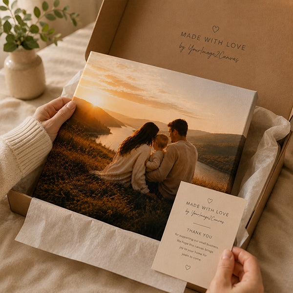A personalised family canvas being unboxed as a gift