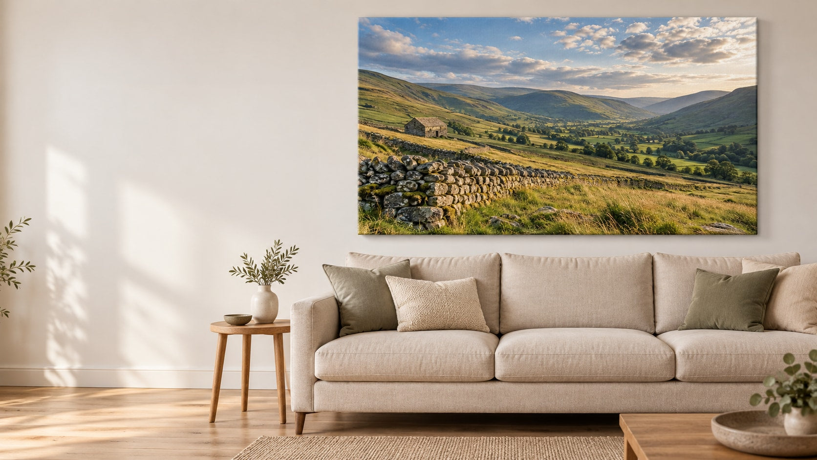 A large valley-photo canvas above a linen sofa in a calm living room.