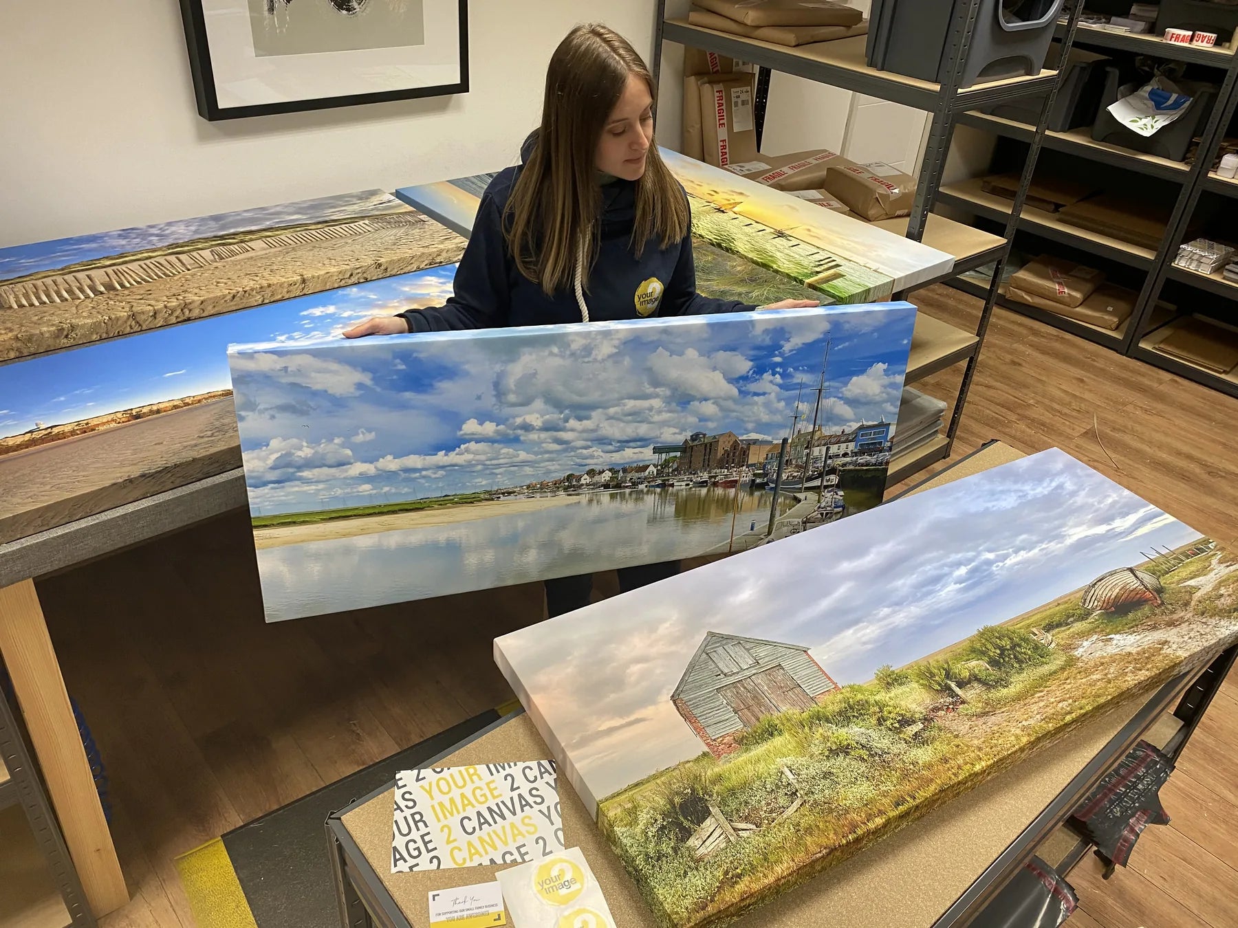 A finished photographic print being checked in the workshop