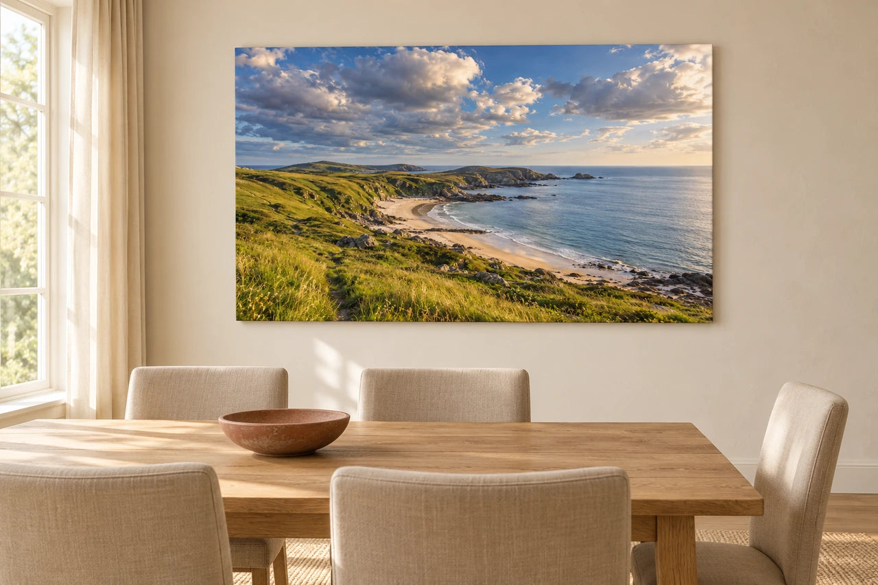 The fictional coastal image displayed on a canvas above an oak dining table in a warm ivory-and-linen room.