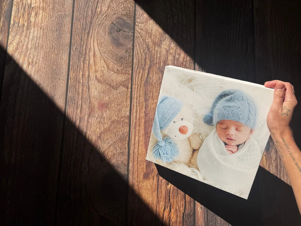 A complete baby photo canvas held over our wooden worktop in daylight