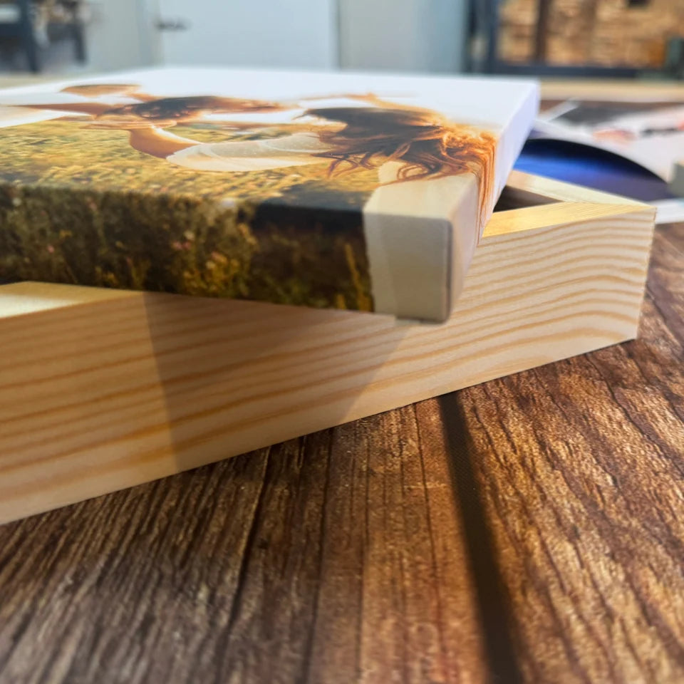 Close view of a canvas corner beside a solid pine frame