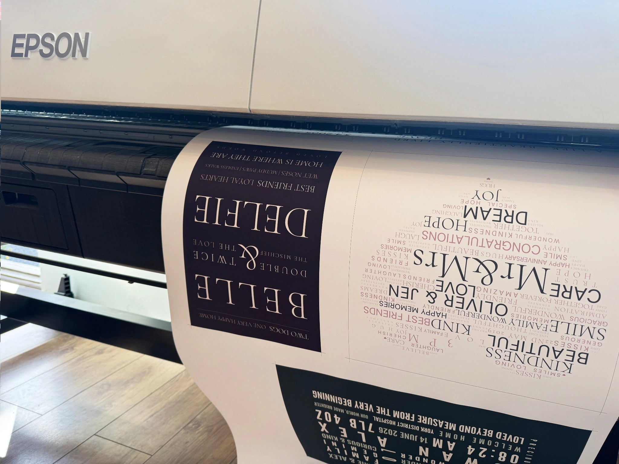Belle and Delfie and wedding Word Art designs emerging from an Epson large-format printer.