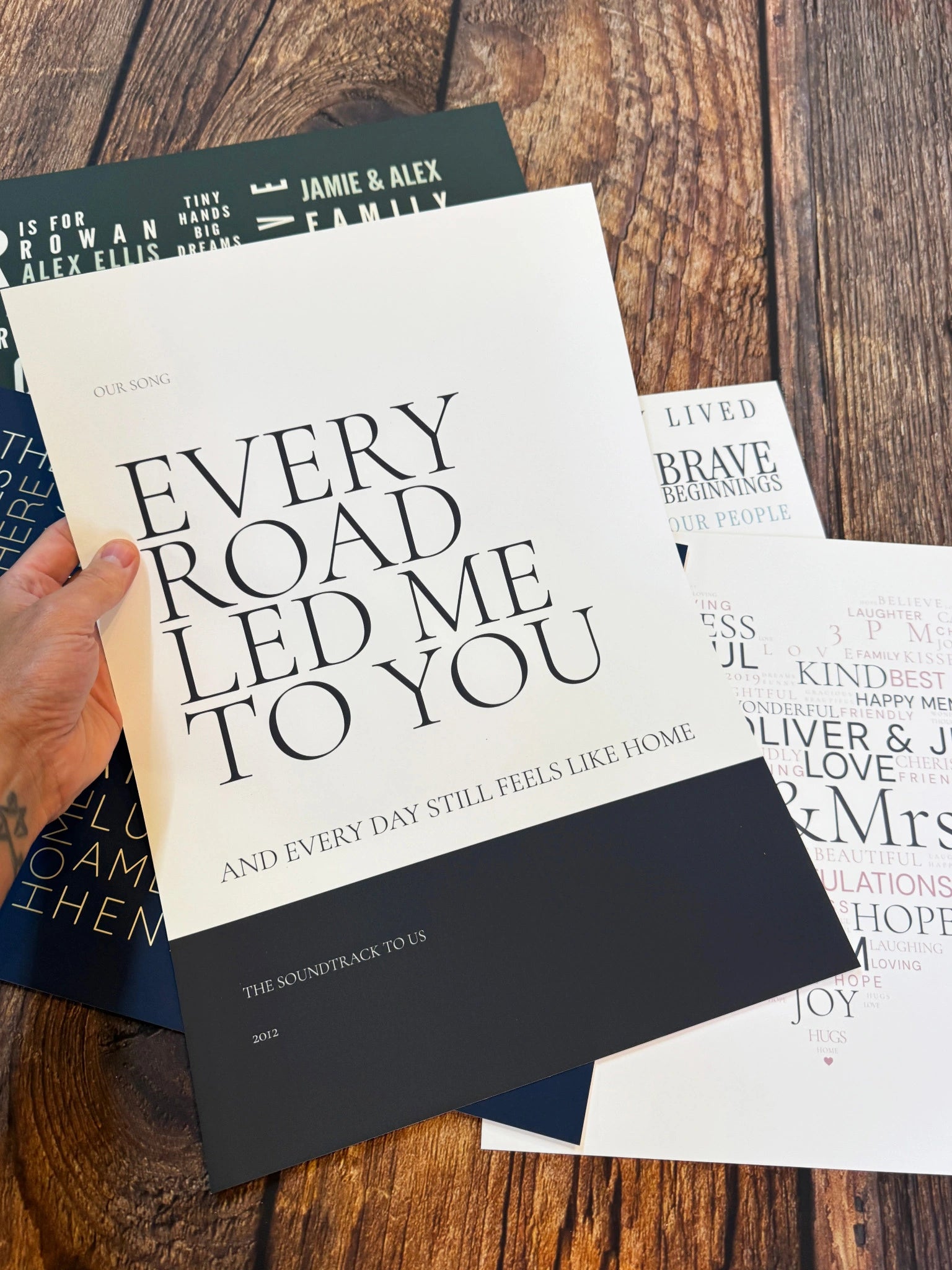 An Every Road Led Me to You statement poster held above a selection of Word Art designs.