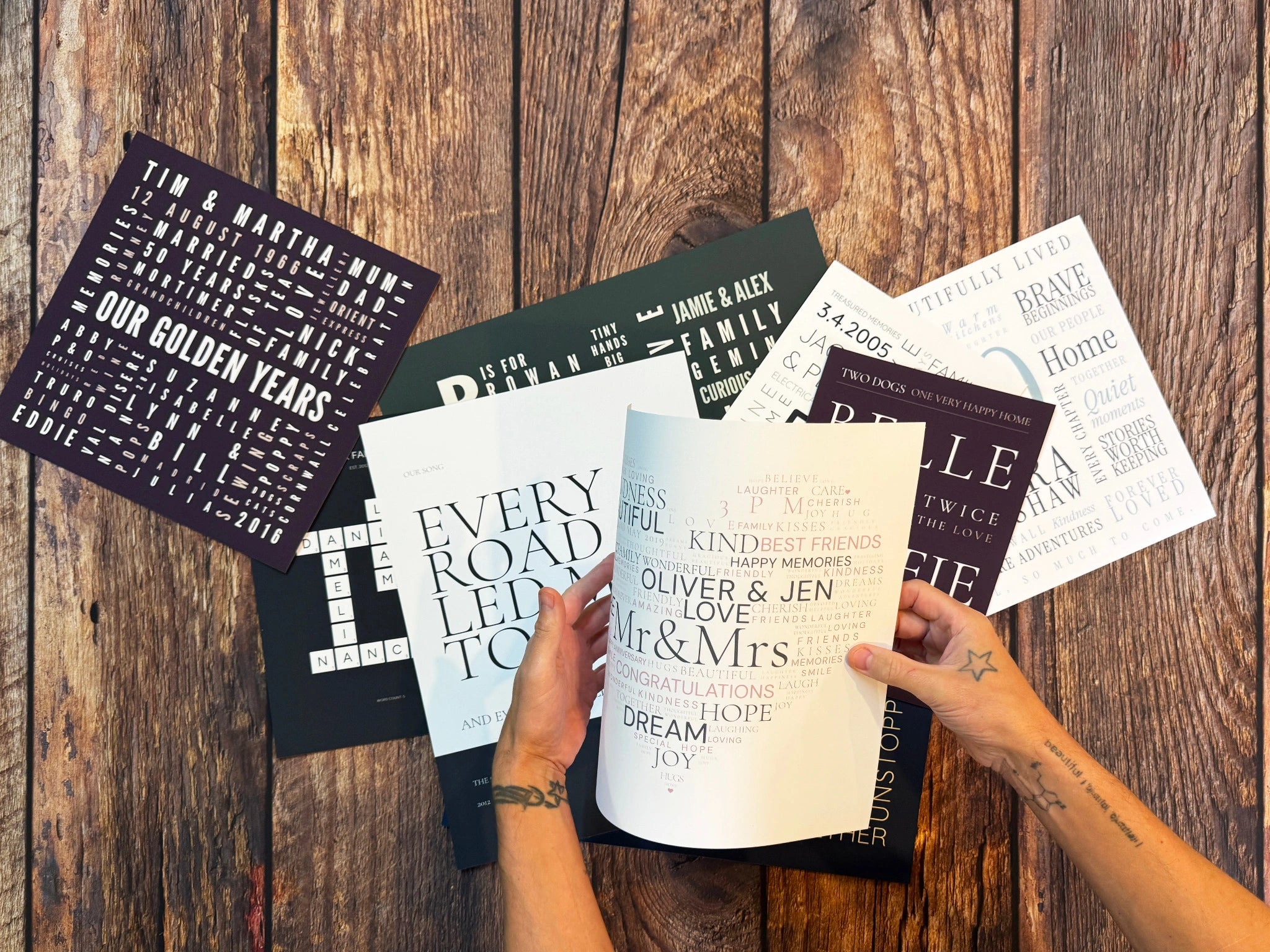 Hands gently bending a Word Art poster to show the smooth matte paper.