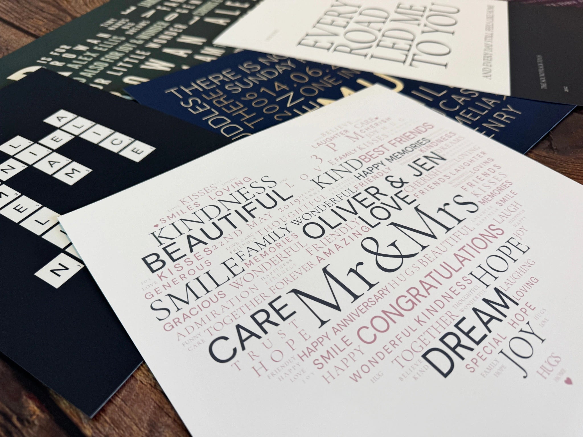 A close view of a personalised Mr and Mrs Word Art poster among other printed designs.