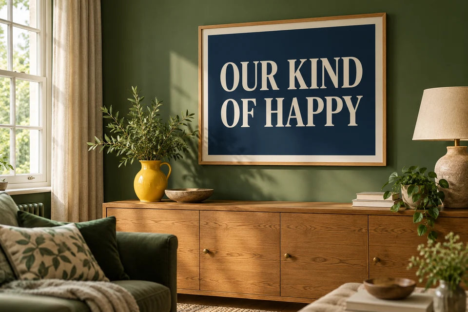 Cream lettering on a navy Word Art poster displayed in a rich green living room.
