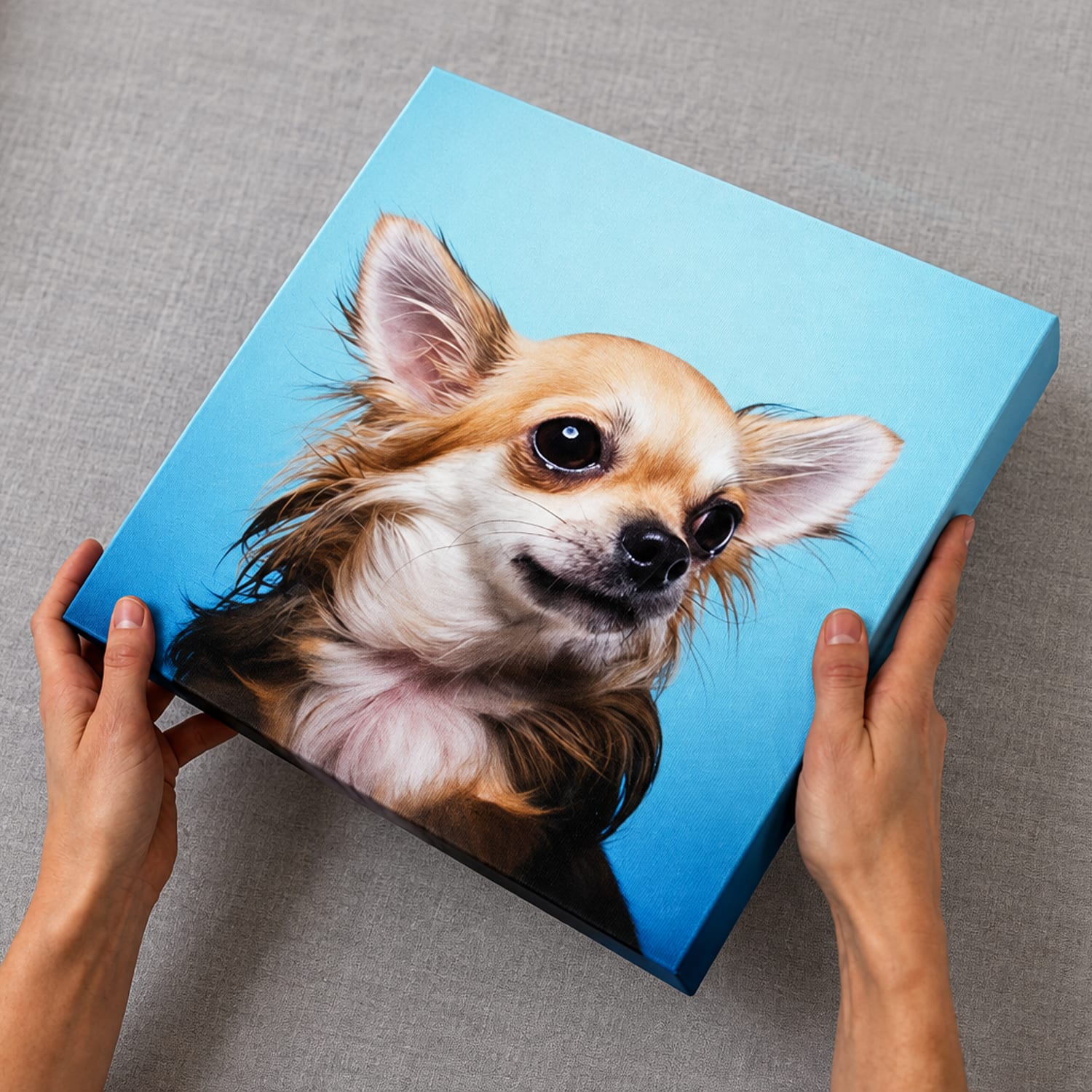 A bright blue dog portrait printed on a finished canvas