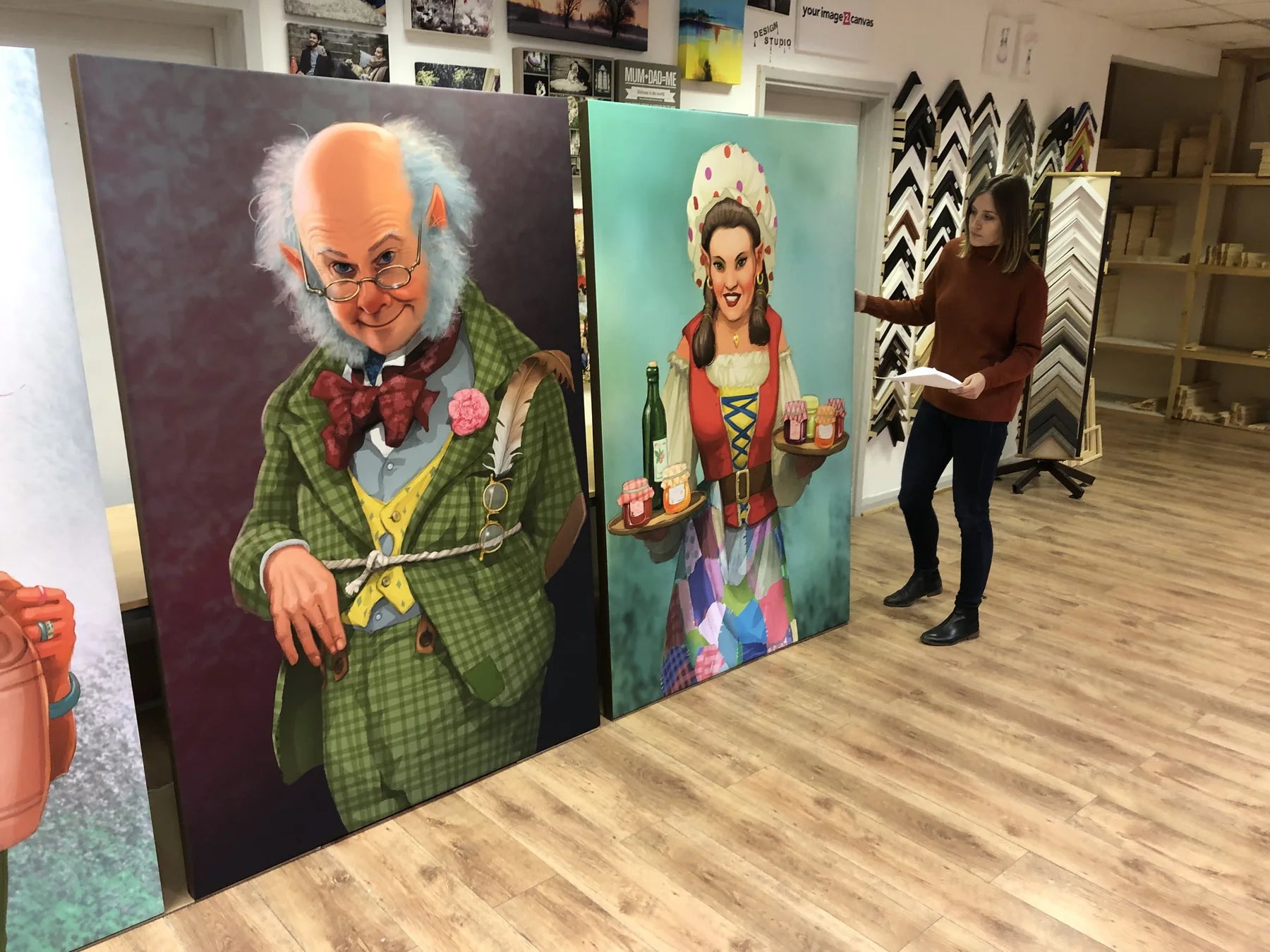 Two tall illustrated display panels standing in the print room