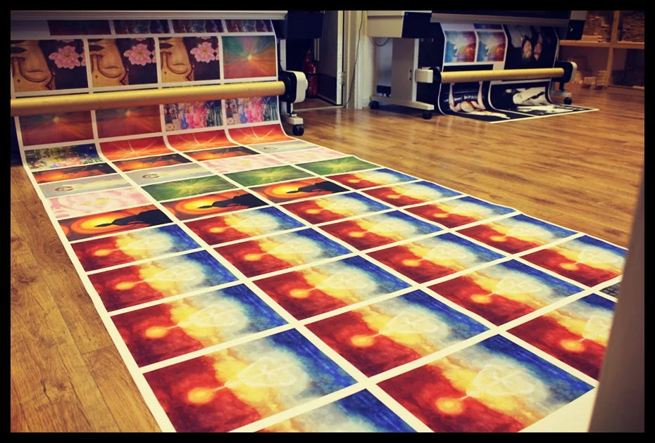 Rows of colourful photographs coming off an early large-format printer