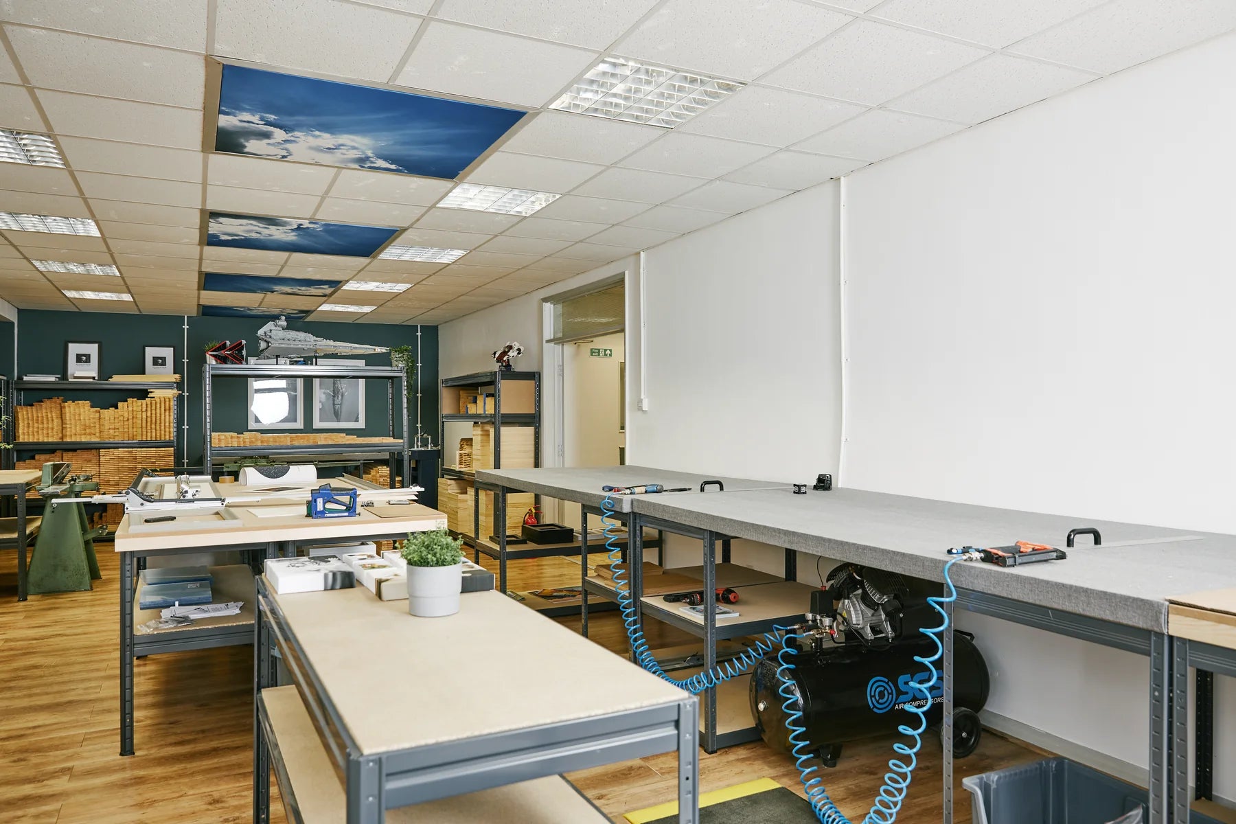Bright YI2C workshop prepared with long finishing benches and tools