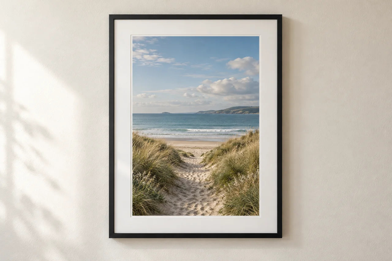 Portrait coastal poster displayed in a white mount and black frame.