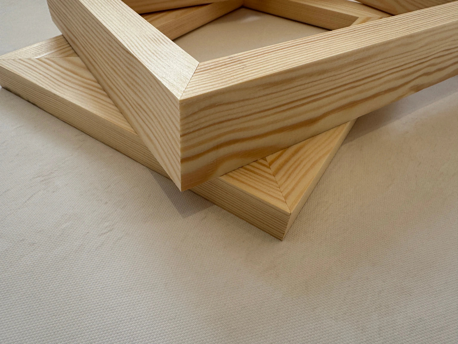 Real solid pine stretcher bars showing the joined canvas frame corners and wood grain