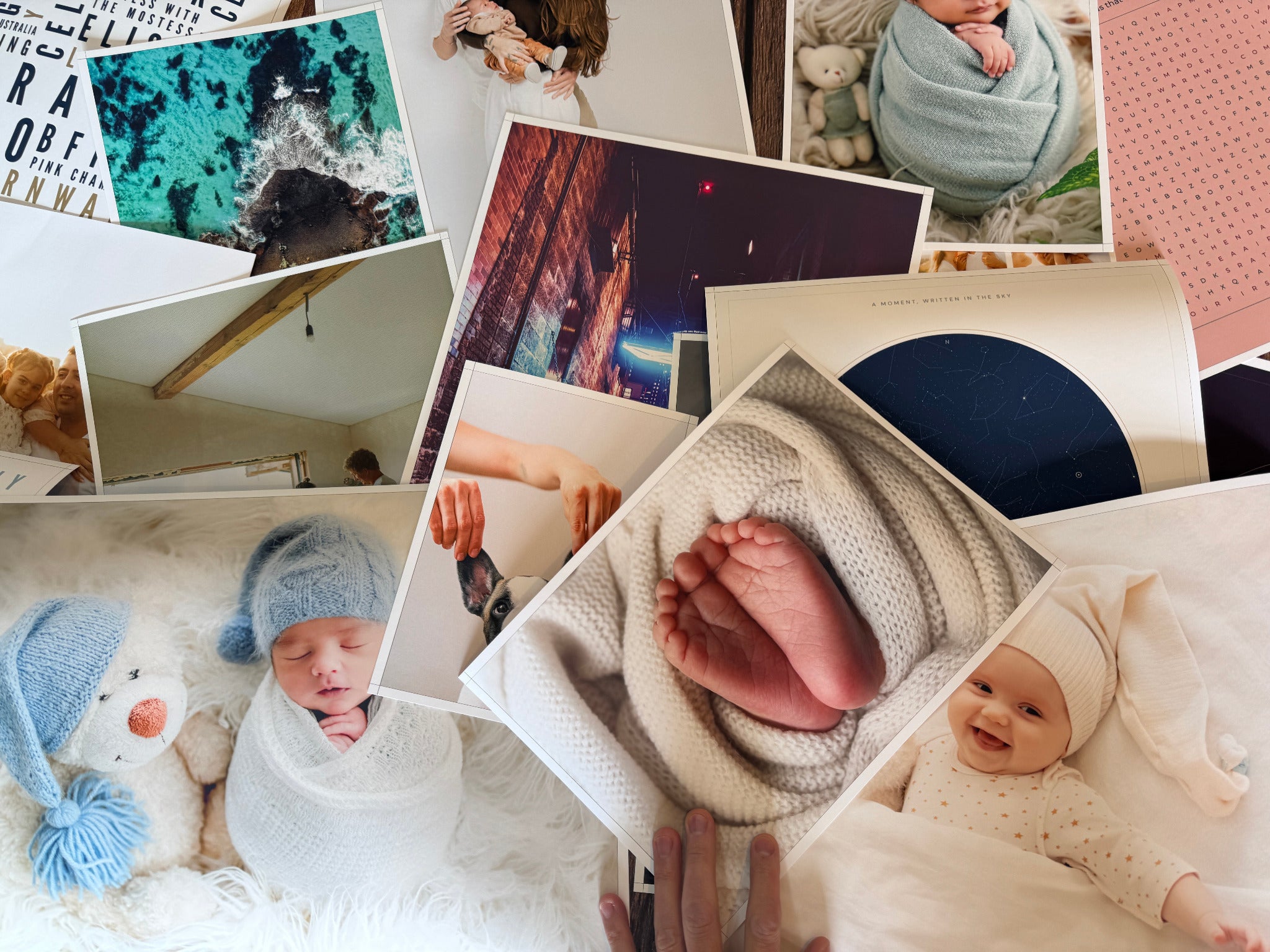 Photo posters and personalised prints arranged together on a wooden table.
