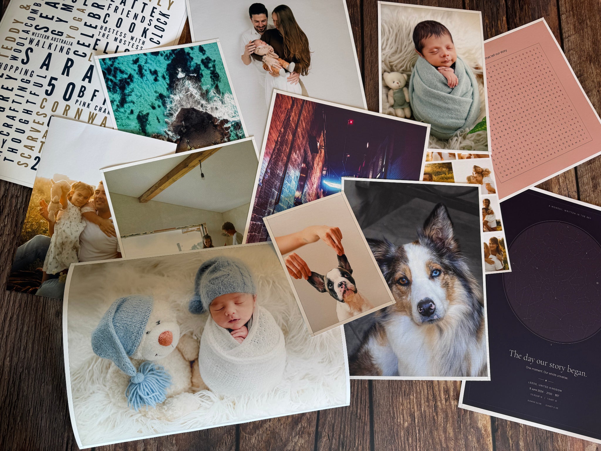A selection of photo posters, word art and star map prints arranged on a wooden table.