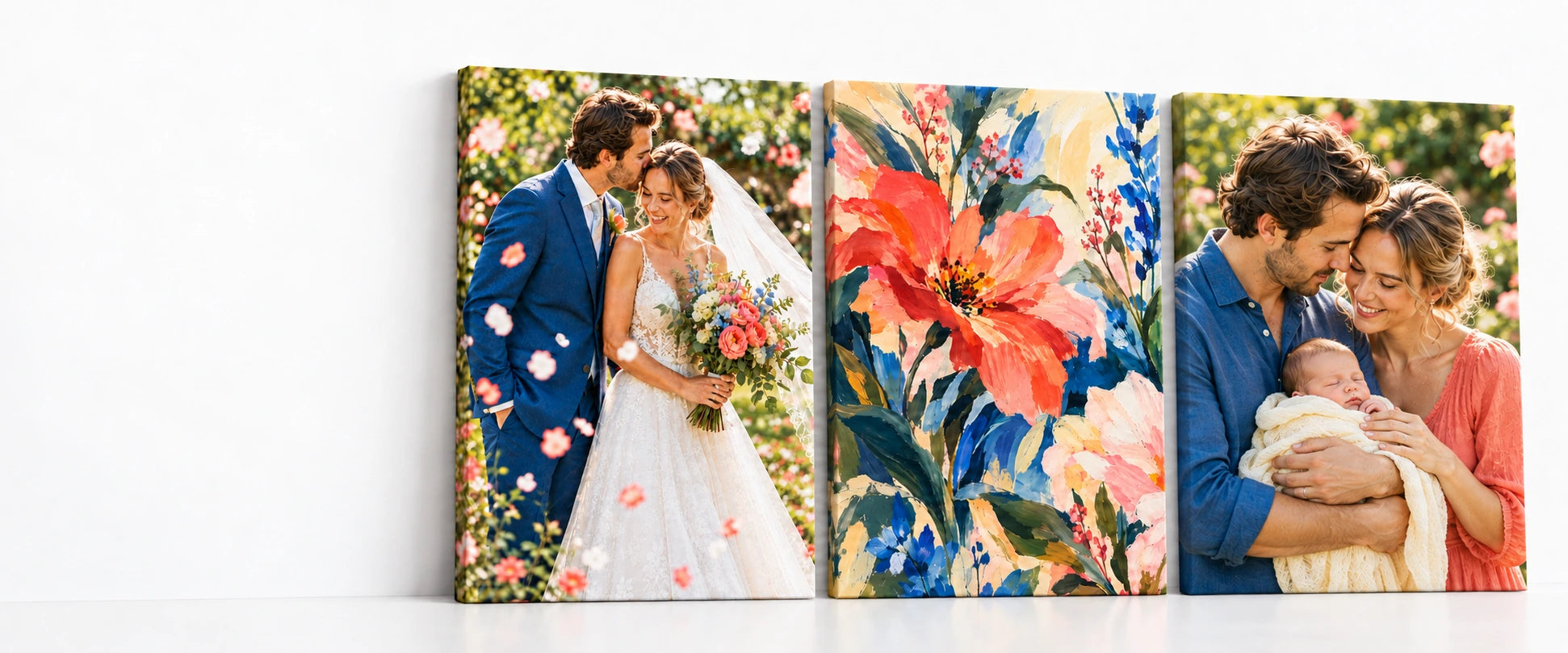 Three canvas prints on a white surface: a wedding portrait, colourful floral artwork, and the couple holding their first baby.
