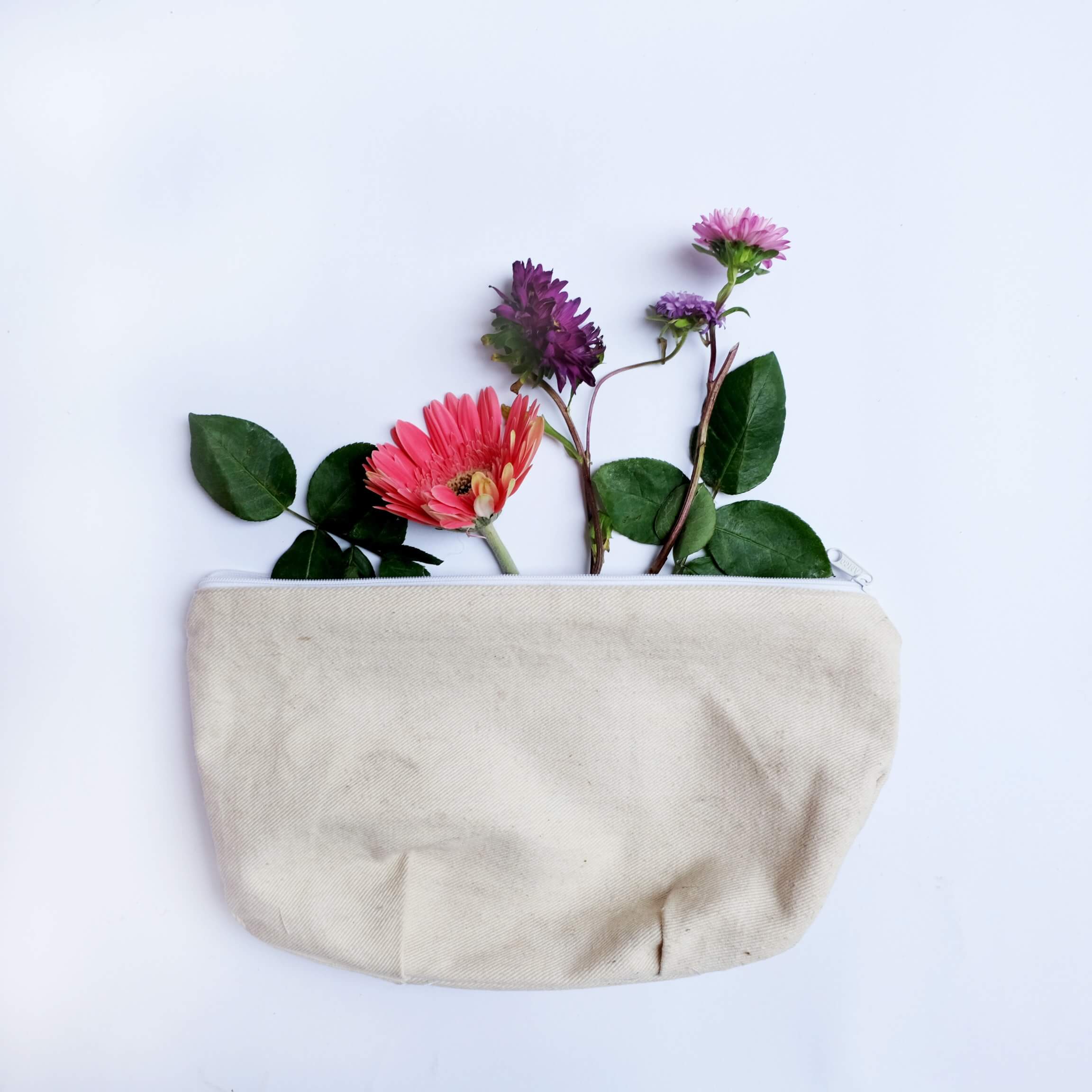 Spring flowers in a cream canvas bag for storage