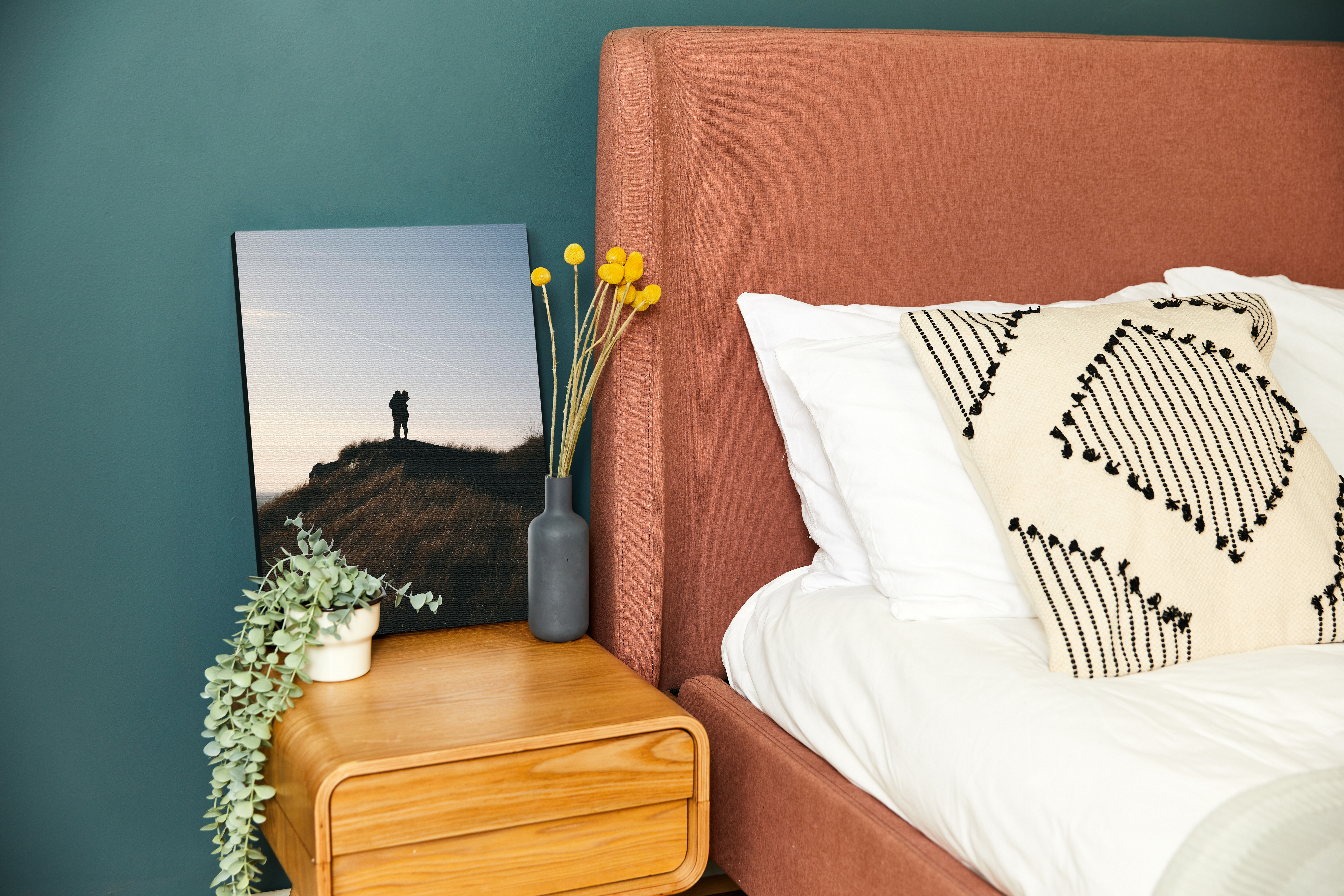 Beautiful custom quality canvas print of landscape sunset photography with focal point dispayed on bedside table