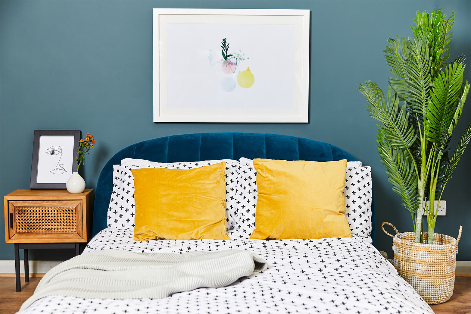 Beautifully decorated bedroom using canvas wall prints and picture frames to brighten up the room.