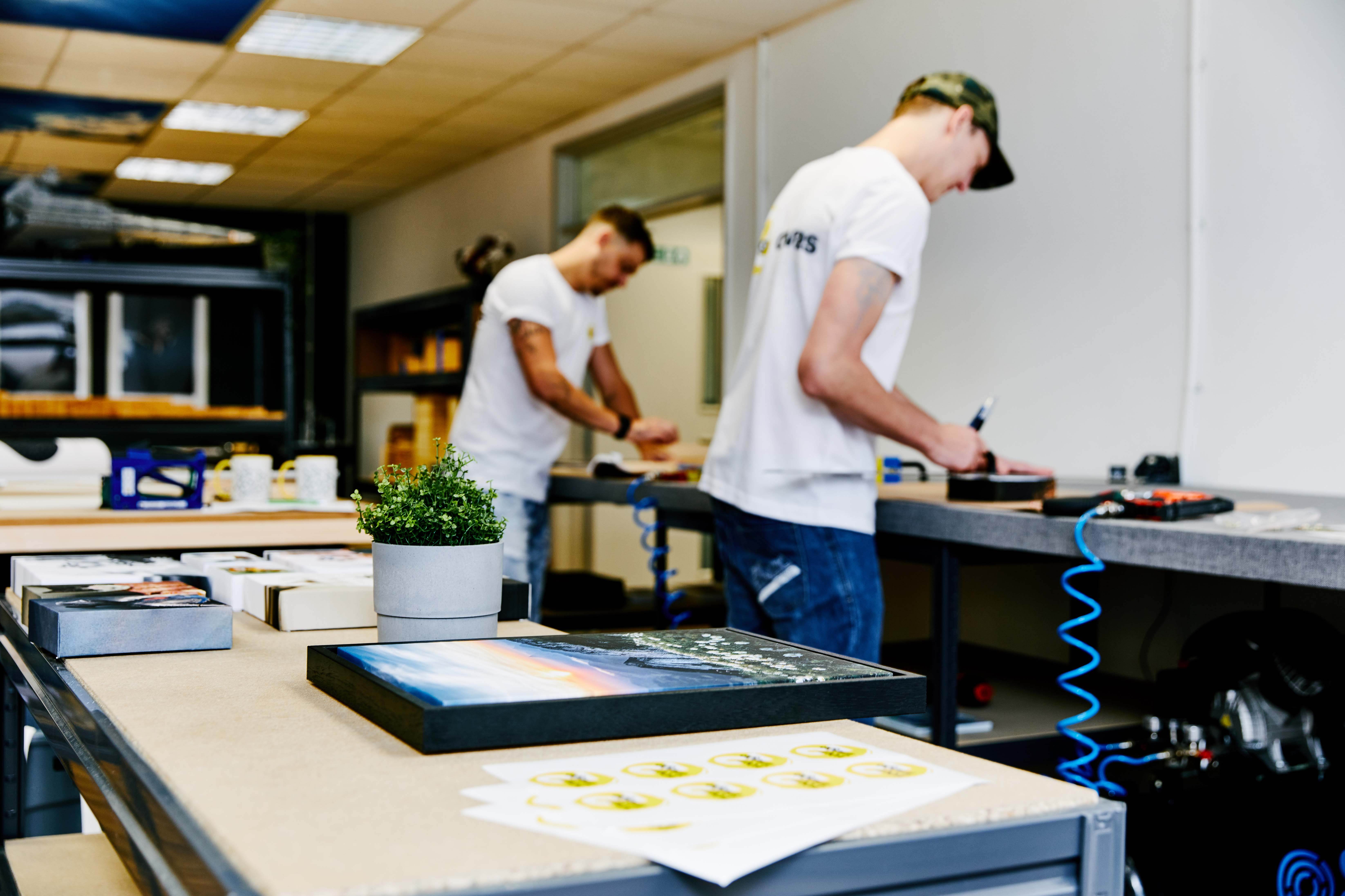 a photograph ofour team busy at work creating the best hand made and long lasting canvas prints uk to decorate your home or give as a gift to a loved one
