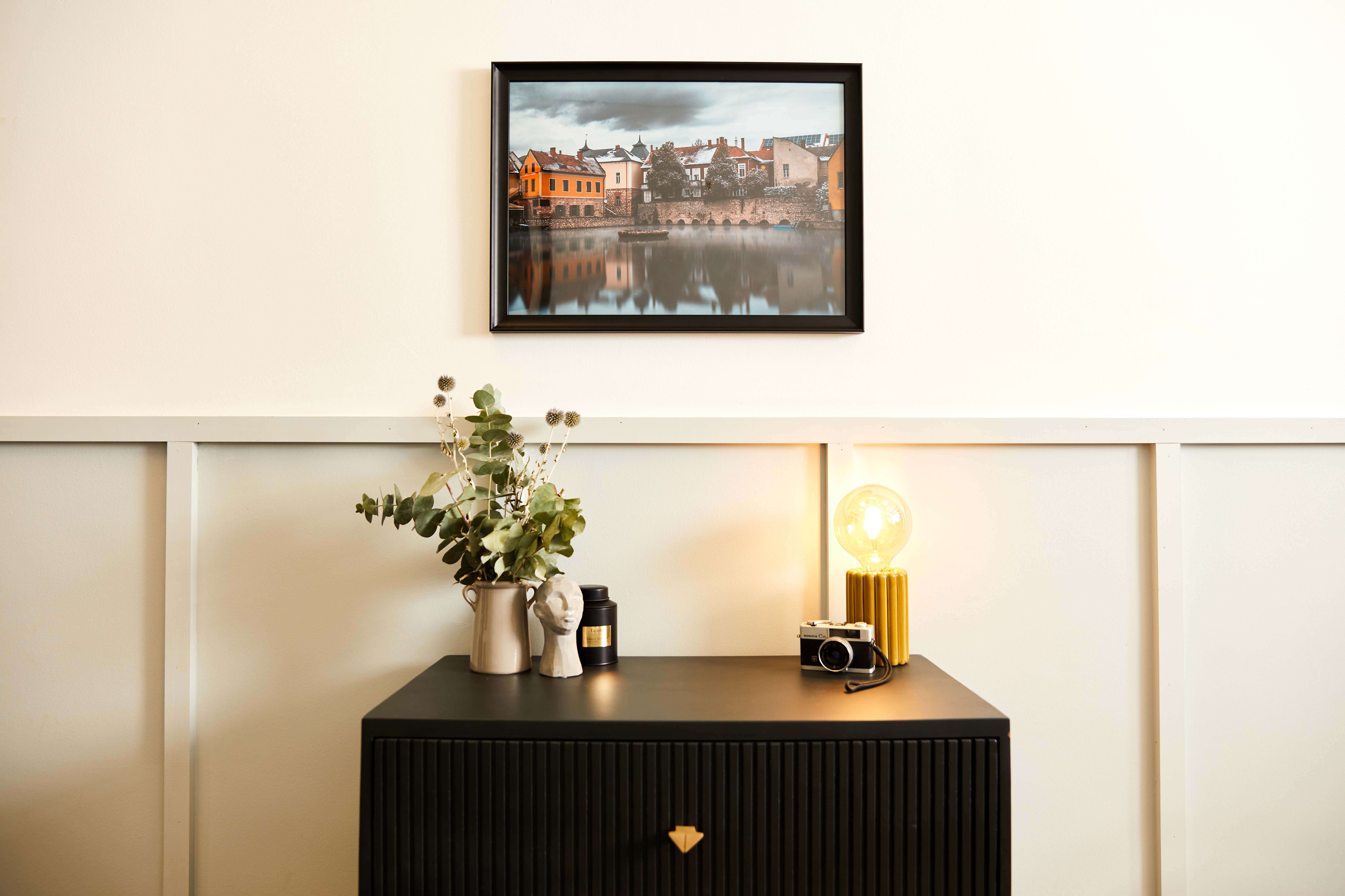 A handmade affordable canvas print in a made to order classic black frame displayed in home