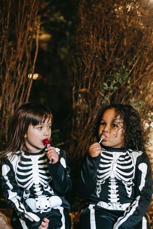 Photograph of kids dressed in their skeleton halloween costumes would be a great picture to print onto quality cheap canvas and display on your wall